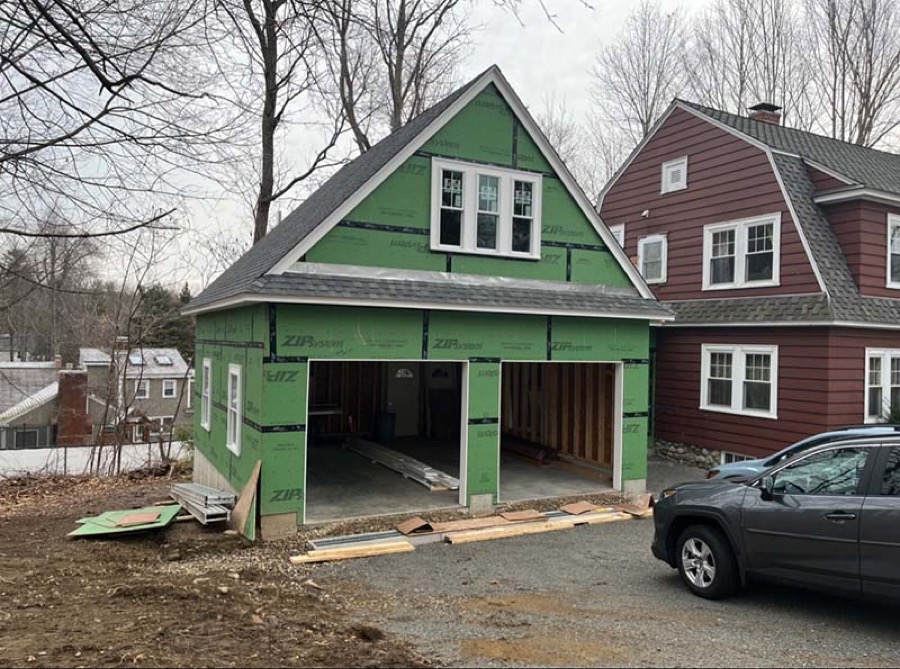 A Salisbury Construction home addition in progress with garage